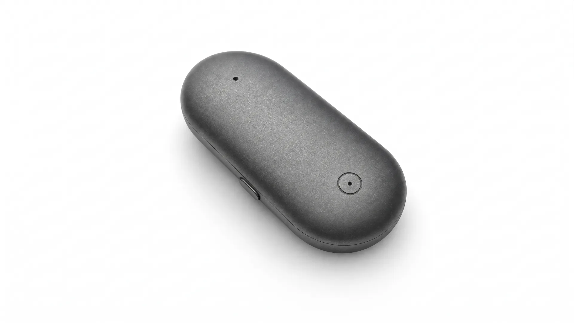 Meetly Capsule, a small warm-graphite pebble.