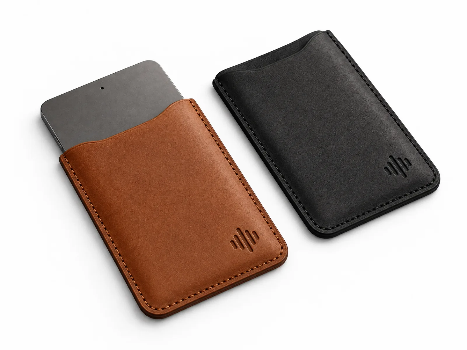 Meetly Card leather sleeves in cognac and black, each with the small Meetly mark debossed.